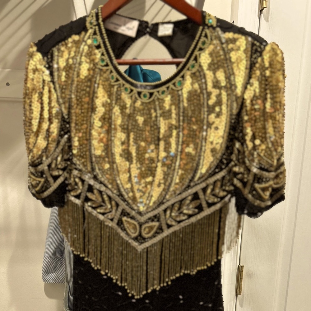 Vintage black silk dress with gold beads. Very nice vintage dress.